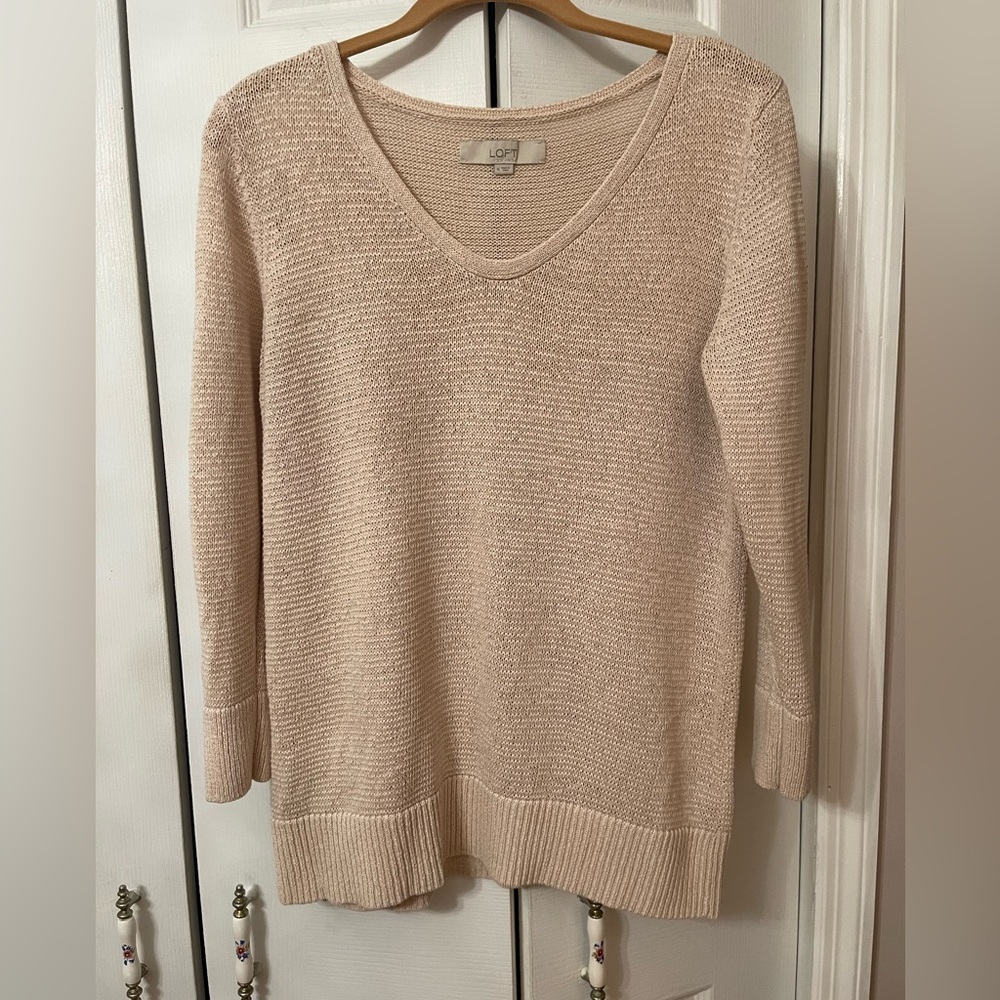 The Loft V-Neck Sweater in Beige is a versatile and stylish pullover for women